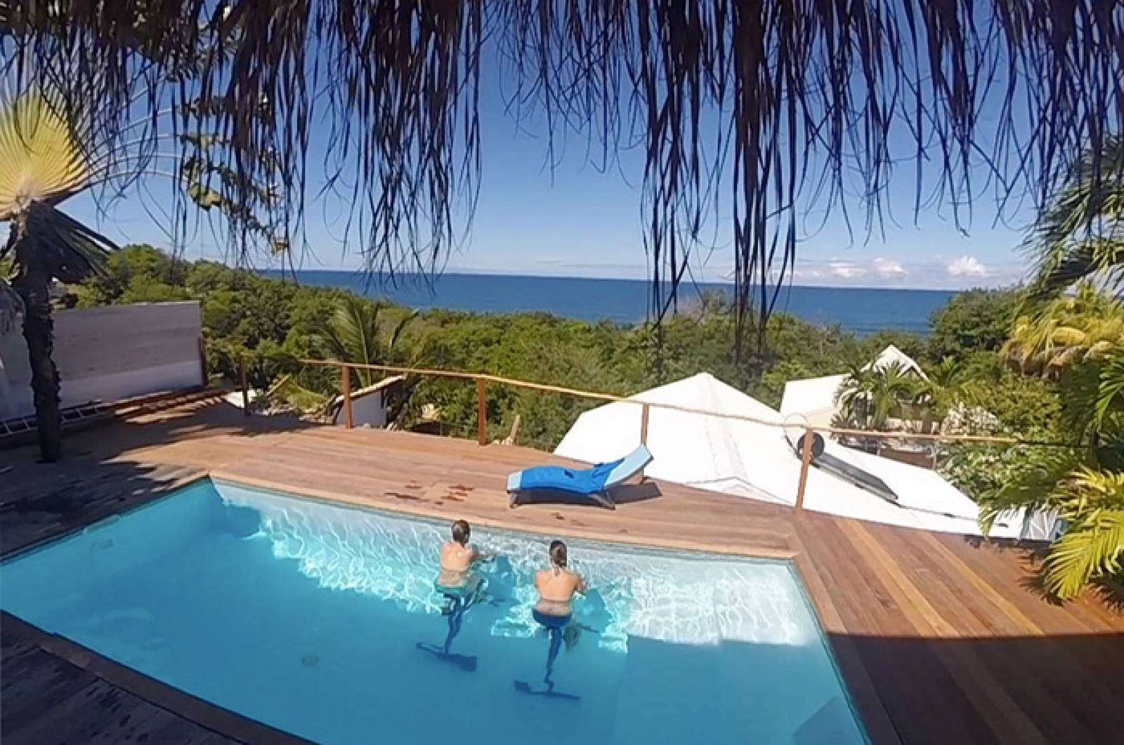 découvrez la plage de tartane en martinique, un paradis tropical aux eaux turquoise, parfait pour la détente, la baignade et les sports nautiques.